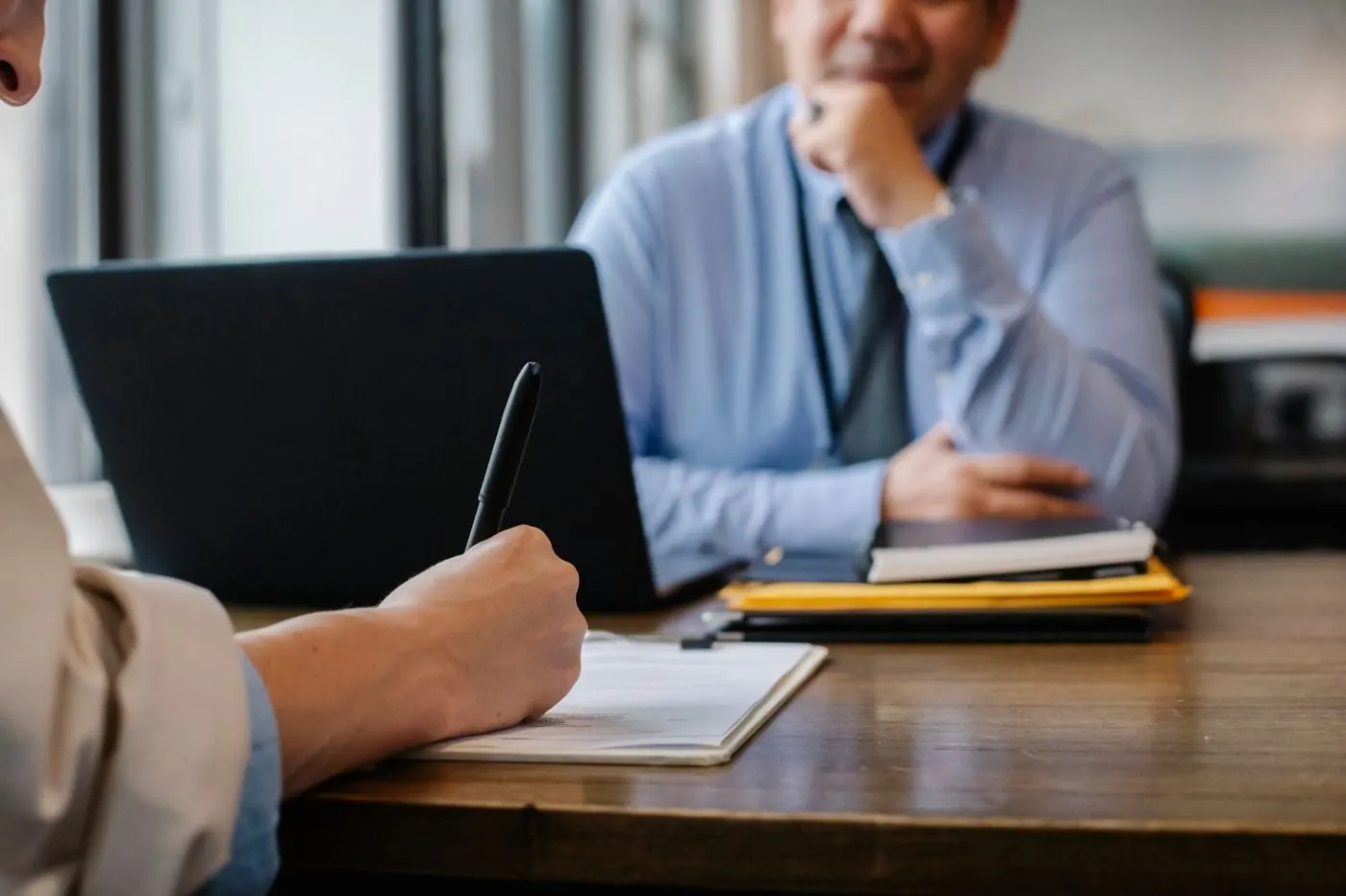 Business meeting with notes before signing a solar quote