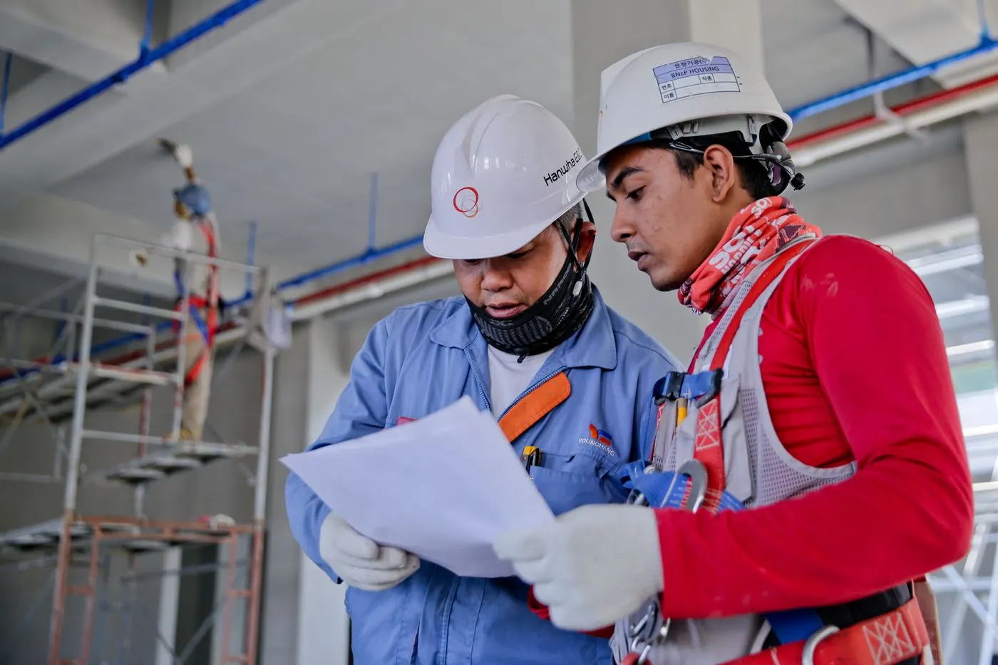 Site engineers reviewing plans on a construction project